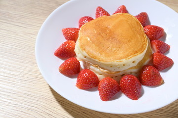 pancake and strawberry fruit sweet dessert food put on breakfast table
