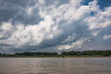 clouds over the amazon river