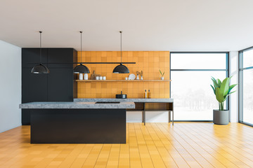 Yellow and black kitchen with island