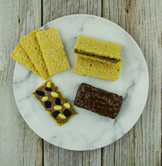 Homemade granola bars with peanut chocolate spread and raisins for chocolate