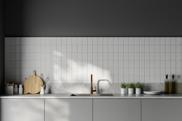 Grey countertops in white kitchen
