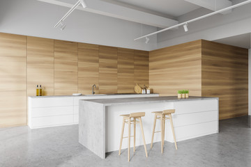 White and wooden kitchen corner with island