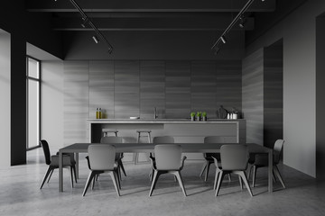 Gray and wooden kitchen interior with table