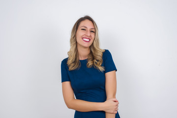 Positive human facial expressions and emotions. Isolated shot of attractive student girl looking and smiling broadly at camera during nice conversation with someone.