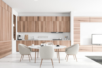 White brick and wood kitchen interior with table