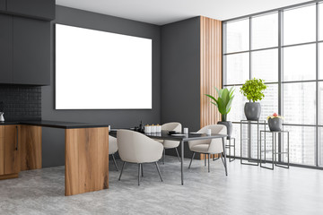 Gray and wooden dining room corner with poster