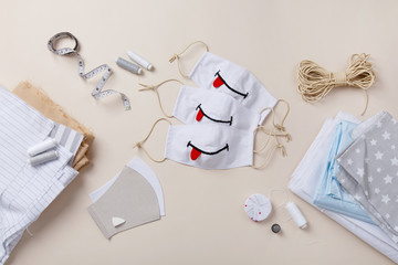 Homemade mask with smile. DIY face mask for stay safe at pandemic or quarantine. Funny handmade child anti-virus mask. Sewing zero waste Cotton natural kids mask against infection. Smile and stay safe