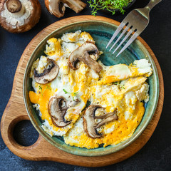 scramble fried eggs
omelet with mushrooms
Menu concept healthy eating. food background top view copy space for text
keto or paleo organic product diet