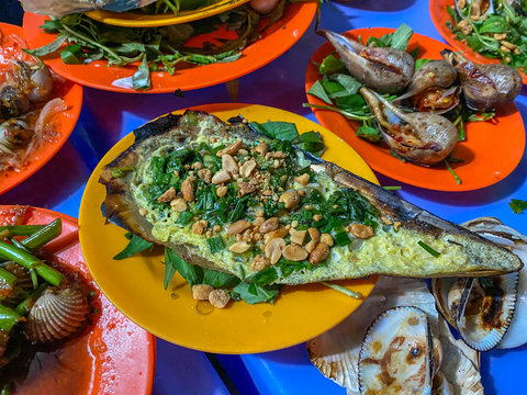 Vietnamese dish- grilled pen shell mixed with scallion and peanuts