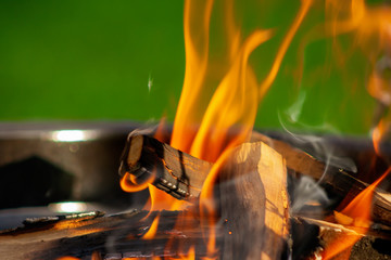Barbecue Grill. Fire flame on green grass background.  Barbecue Grill with Fire on Open Air. Fire...