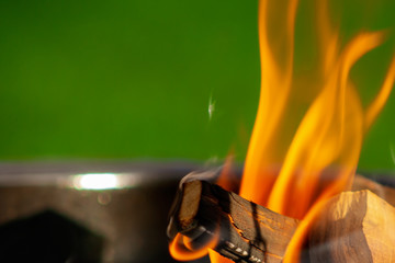 Barbecue Grill. Fire flame on green grass background.  Barbecue Grill with Fire on Open Air. Fire flame...