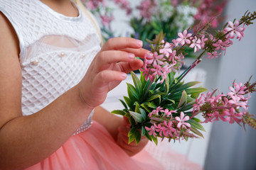 Girl holding a bouquet of pink fresh flowers