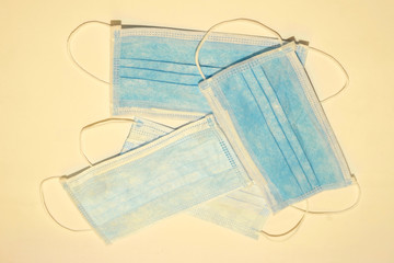 Four respiratory antibacterial masks on a white background