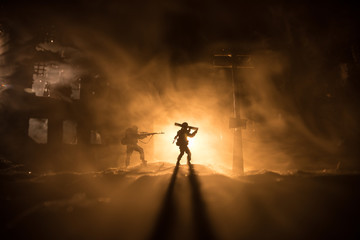 War Concept. Military silhouettes fighting scene on war fog sky background, World War Soldiers...