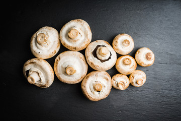 Freshly harvested mushrooms on the rustic wooden background. Selective focus. Shallow depth of field.