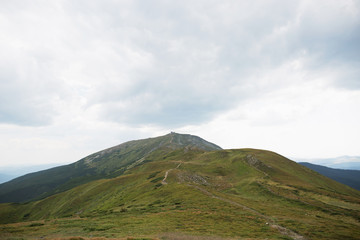 Beautiful landscape of green mountains. Travel outdoors.