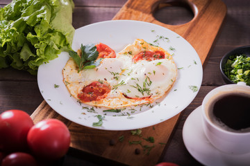 Fried eggs with green and vegetables. Helthy and delicious Breakfast.