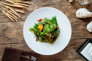Healthy fresh greens and tomatoes salad  
