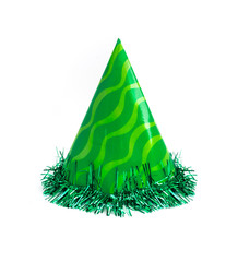 Green party cap made of paper, isolated on white background. Holiday cup, carnival accessory with tinsel.