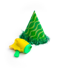 Green party cap made of paper, isolated on white background. Holiday cup, carnival accessory with...