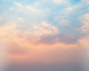 Beautiful sky with cloud before sunset. Colorful sky in twilight background. Bright Blue, Orange And Yellow Colors Sunset.