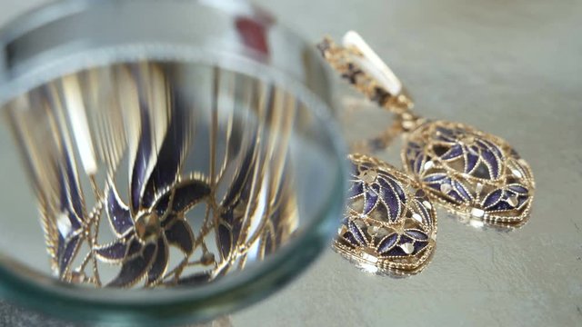 jeweler looking at jewelry through magnifying glass, jewerly inspect and verify, pawnshop concept, jewerly shop concept