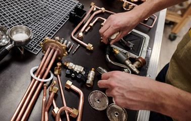The master repairs the coffee machinecoffee, boiling water, cooking,