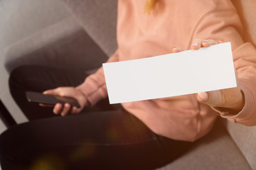 Obraz premium woman hand holds white for text lettering. concepts stay home