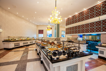 A row of food containers in hotel restaurant
