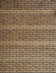 Creative masonry with yellow-brown corrugated bricks