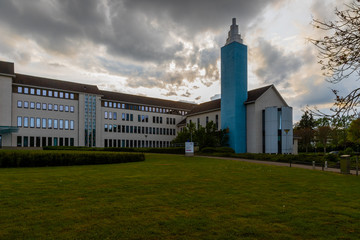 Former hospital and christian church in Maastricht currently in use as the court house in the evening with a dramatic sky