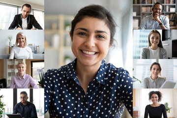 Headshot portrait screen application view of multiracial smiling young businesspeople have online...
