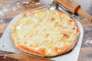 quattro formaggi four cheese pizza the wood table oven peel paddle