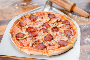 Quattro carni salami pizza meat  the wood table oven peel paddle