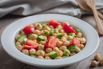 Chickpea salad in bowl, healthy vegan food.