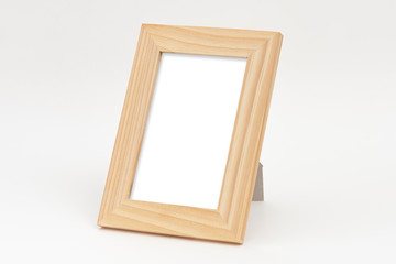 Wooden square photo frame on the white background.