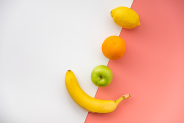 Fruits on a white-pink background