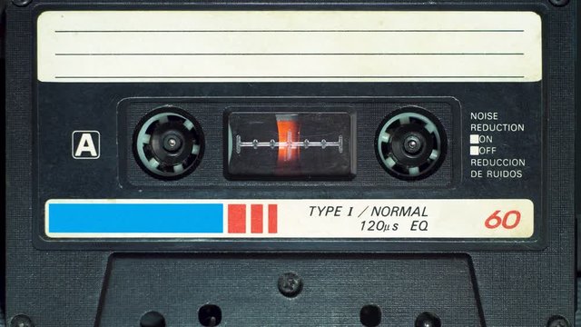 vintage audio cassette plays in tape deck