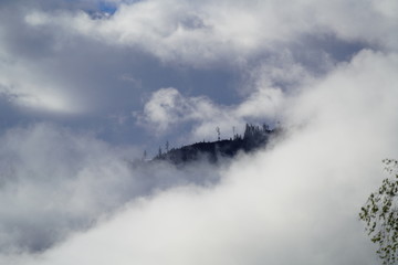 clouds and sun on the morning with window view to the mountains