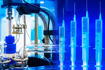 Chemical reaction. The interaction of the chemicals. The girl watches the process in a test tube. Quality control of food products. Chemist at work.