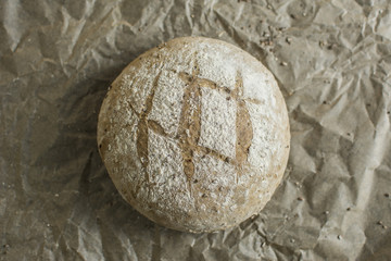 Fototapeta na wymiar Rustic Bread and crumbs on paper