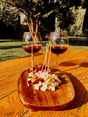 Glasses Of Fine Red Wine With Grape and cheese