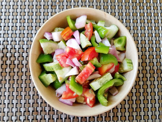 the view from the top. Vegetable mix salad on a plate. Delicious and healthy dish. Concept of dietary nutrition and healthy food
