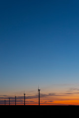 Fototapeta premium Wind turbines during sunrise, Southern Moravia, Czech Republic