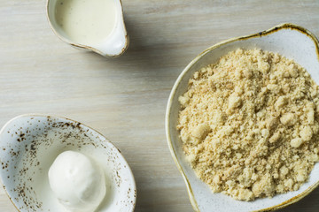 Crumble with custard on light Background