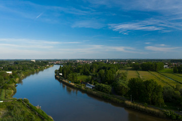 Fototapeta premium Aerial view of the Scheldt river, in Grembergen, Belgium