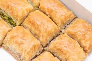 Turkish Ramadan Dessert Baklava isolated on beige plate.