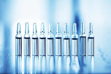 ampoules medicine vaccine concept, abstract background, vaccination virus protection