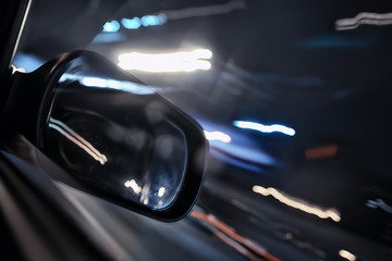 traffic of cars in the night city, view from the car, lights abstract auto background