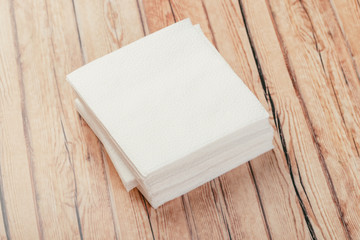 white paper napkin with a textured pattern on an old table